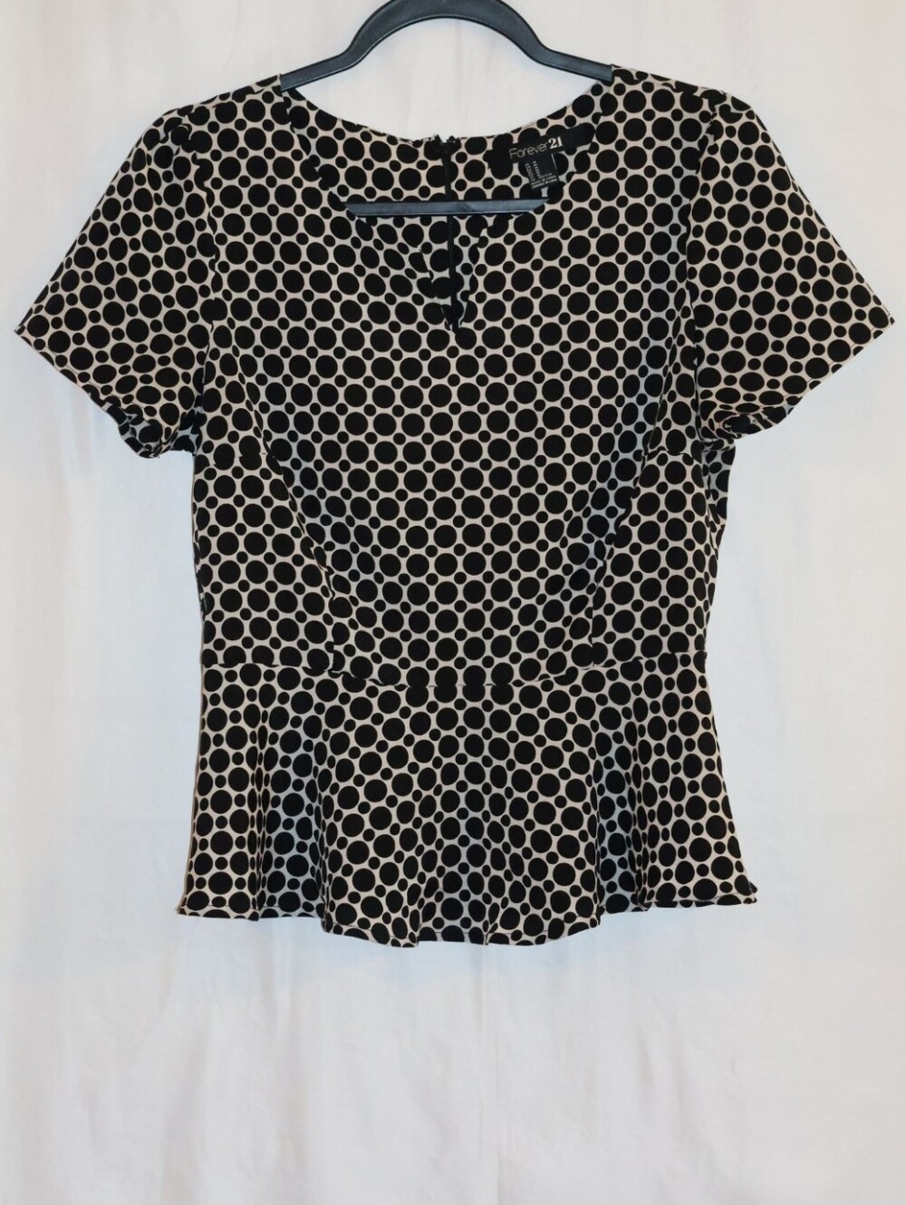 Forever 21 Black and Cream Polka Dot Peplum Blouse.